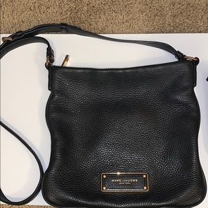 Black Marc Jacobs crossbody bag .